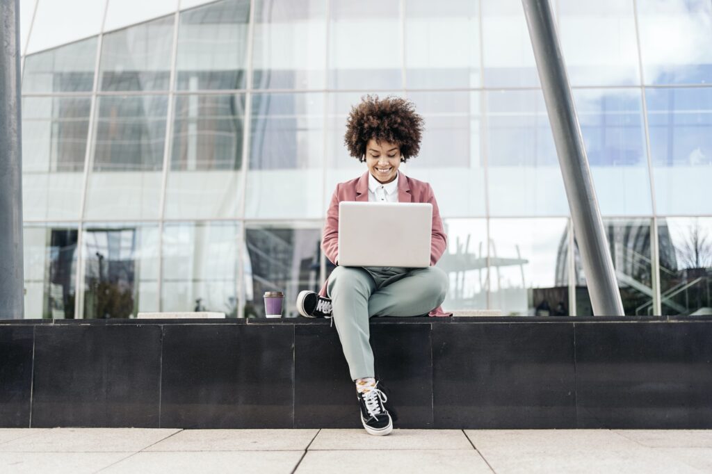 Business Woman Using Laptop Outdoors